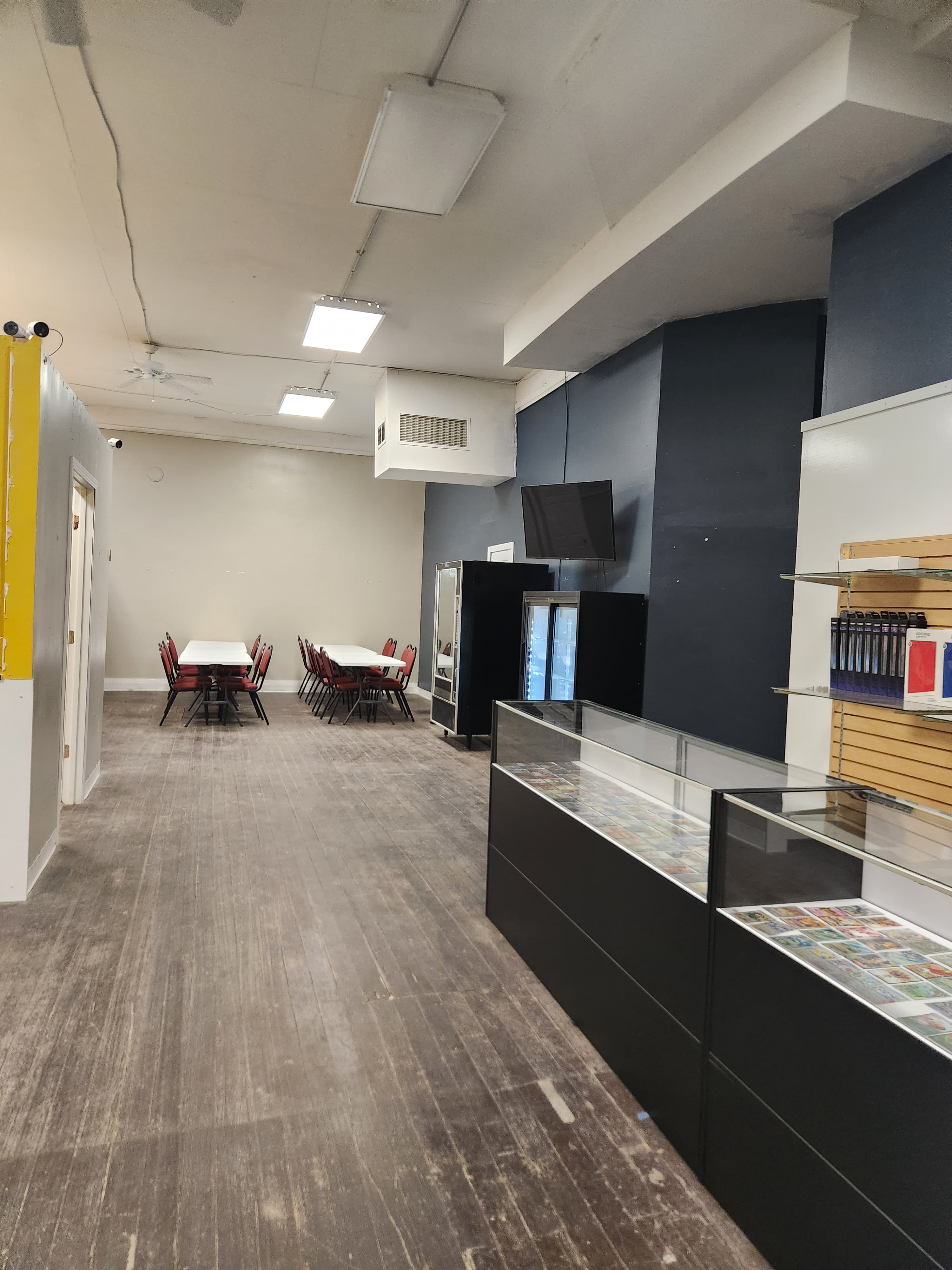 Interior of The Wolf Den in Montgomery, Minnesota with product displays and community play tables